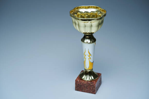 golden trophy on gray background